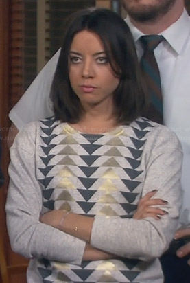 April’s grey and gold triangle sweater on Parks and Recreation