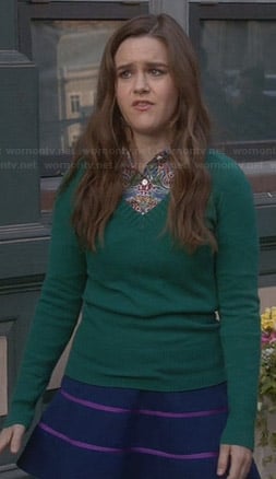 Betsey’s blue skirt with pink stripes and green sweater on The Mindy Project
