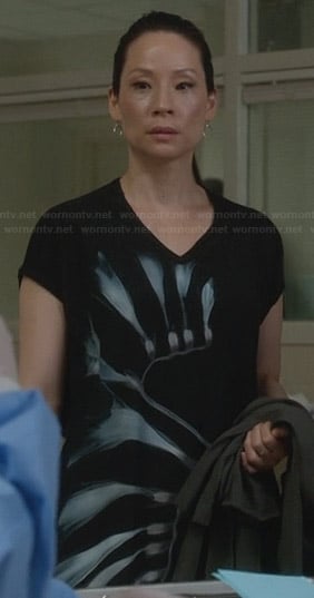 Joan’s black and blue floral graphic print dress on Elementary