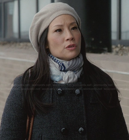 Joan’s grey coat and blue striped scarf on Elementary