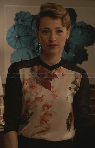 Margaux’s black top with floral front panel on Revenge