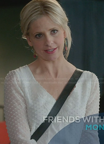 Sydney’s white swiss dot blouse on The Crazy Ones