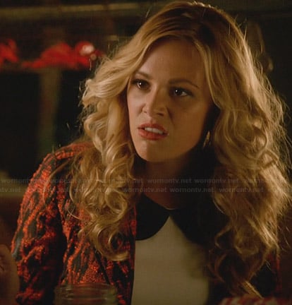 Taylor’s white top with leather peter pan collar and orange patterned jacket on Star Crossed
