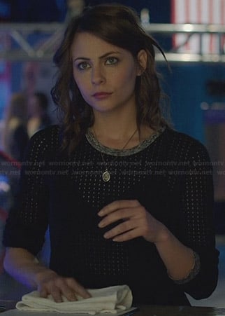 Thea’s black mesh pullover with grey trim on Arrow
