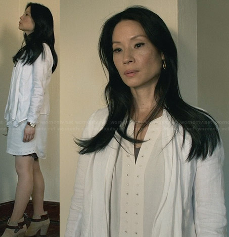 Joan’s white studded trim dress and cardigan and ankle boots on Elementary