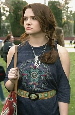 Karma’s blue embroidered cold shoulder top on Faking It