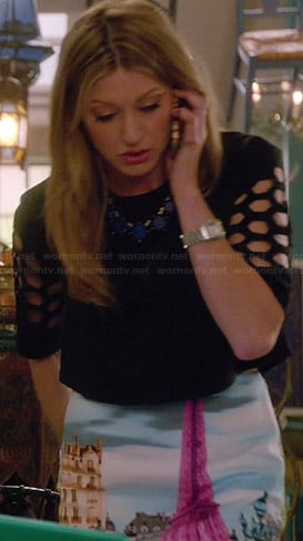 Joss’s Eiffel Tower print skirt and black crop top with cutout sleeves on Mistresses