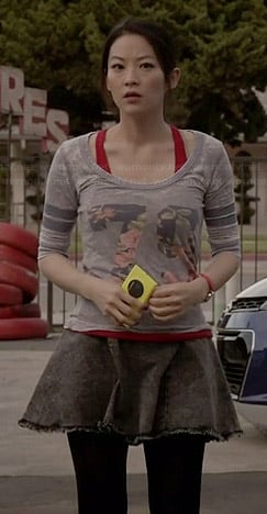 Kira’s floral “79” varsity top and black denim circle skirt on Teen Wolf