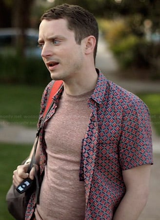 Ryan’s red and navy printed short sleeve shirt on Wilfred