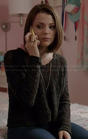 Carter’s black cropped sweater on Finding Carter