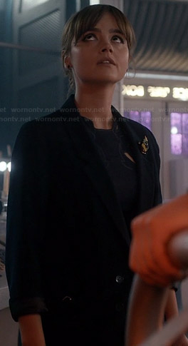 Clara’s navy blazer and beaded brooch on Doctor Who