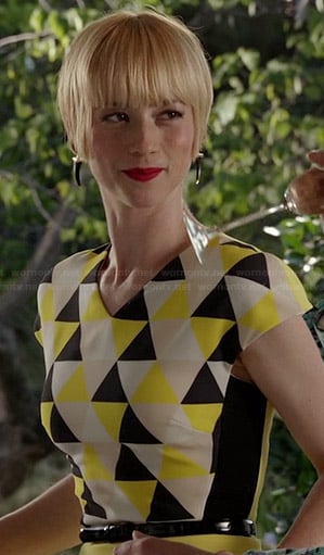 Margaux’s yellow triangle print dress and black horn earrings on Revenge