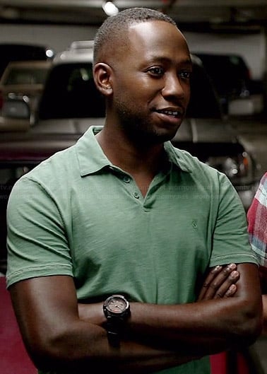 Winston’s green polo shirt with embroidered peace sign on New Girl