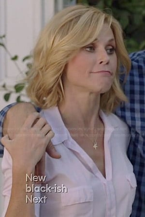 Claire’s white flap pocket top on Modern Family