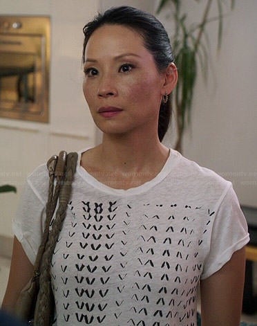 Joan’s white chevron printed tee on Elementary