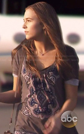 Maddie’s grey printed top with open back on Nashville