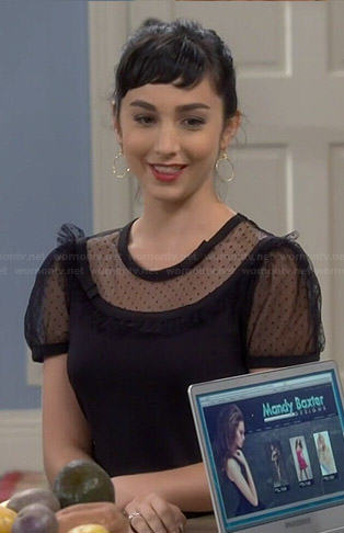 Mandy’s black sheer polka dot panel top on Last Man Standing
