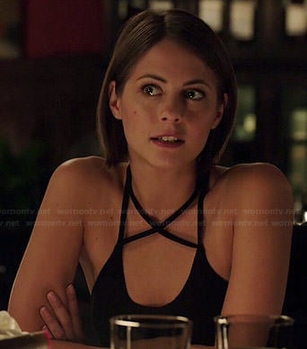 Thea’s black cross strap tank top on Arrow