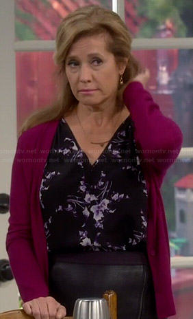 Vanessa’s black and purple floral v-neck top on Last Man Standing