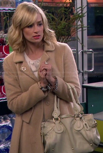 Caroline’s beige furry coat on 2 Broke Girls