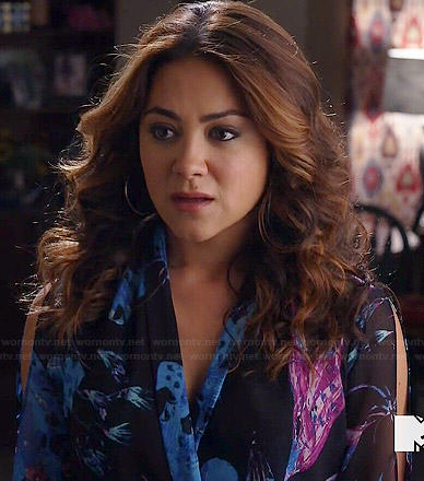 Elena’s black, pink and blue floral wrap blouse on Happyland