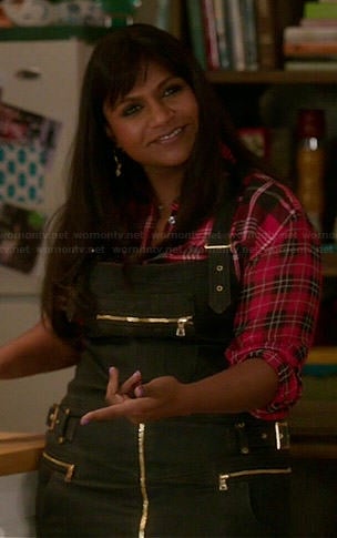 Mindy’s red plaid shirt and black denim overall dress on The Mindy Project