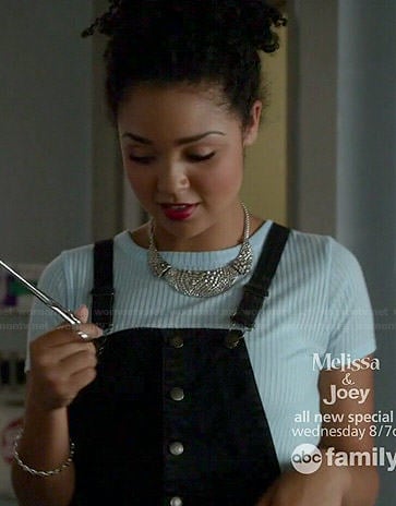 Beth’s blue crop top and black button front overalls on Chasing Life
