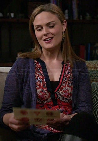 Brennan’s orange printed split neck top on Bones