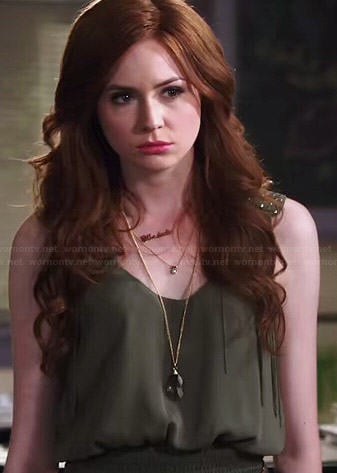 Eliza’s green smocked waist top with studded shoulders on Selfie