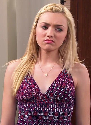 Emma’s purple and pink printed one-piece swimsuit on Jessie