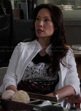 Joan’s black, white and red abstract graphic top on Elementary