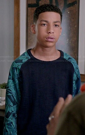 Junior’s navy sweater with green printed sleeves on Black-ish