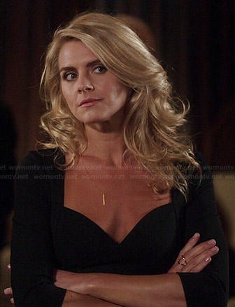 Nina’s black sweetheart dress with three-quarter sleeves on Benched