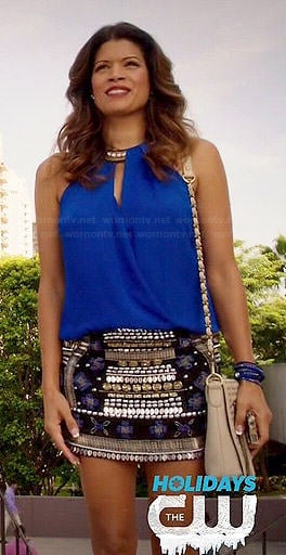 Xiomara’s blue wrap top and embellished skirt on Jane the Virgin