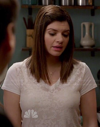 Annie’s white v-neck lace tee on Marry Me