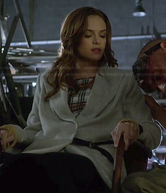 Caitlin’s plaid top and grey coat on The Flash