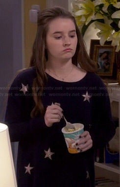 Eve’s navy blue star sweater on Last Man Standing