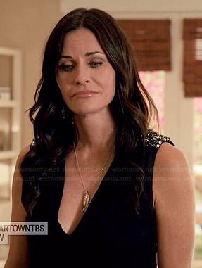 Jules’s black v-neck top with embellished shoulders on Cougar Town