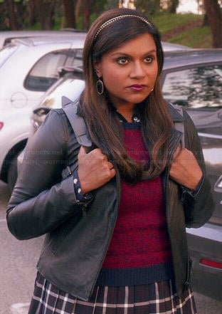 Mindy’s plaid schoolgirl skirt, red sweater, leather jacket and leather backpack on The Mindy Project