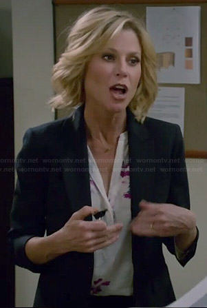Claire’s white and pink floral blouse on Modern Family