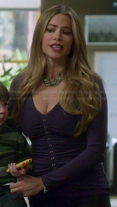 Gloria’s purple studded v-neck top on Modern Family