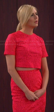 Maddie’s neon pink lace crop top and pencil skirt on Cristela