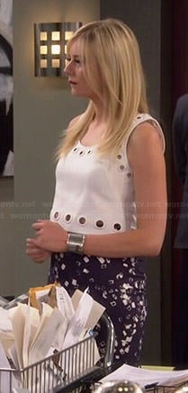 Maddie’s white eyelet crop top and blue printed skirt on Cristela