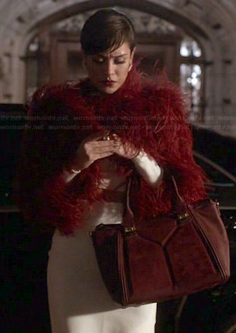 Anika’s white cropped sweater and skirt set with red fur jacket and suede panel bag on Empire