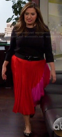 Cristela’s red and pink colorblock pleated skirt on Cristela