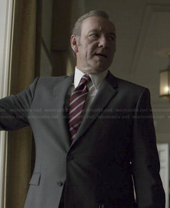 Francis’s black suit with burgundy diagonal striped tie on House of Cards