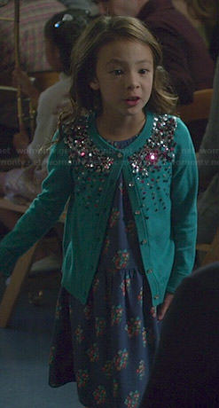 Lily’s blue floral print dress and embellished cardigan on Modern Family