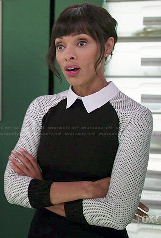Camille’s black collared sweater with white mesh sleeves on Bones