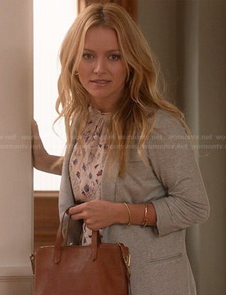 Caryn’s floral top, grey blazer and tan bag on Weird Loners