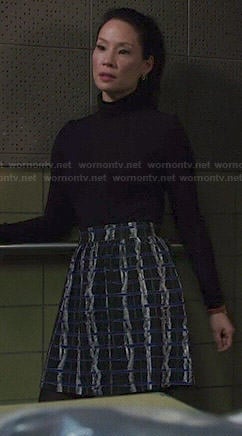 Joan’s blue and black textured print skirt on Elementary